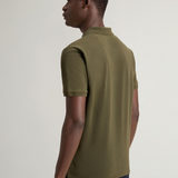 Polo Mackinack tinta in capo in piqué di cotone elasticizzato CFWOPO0065MRUT1483 6006 WOOLRICH Greenstone 