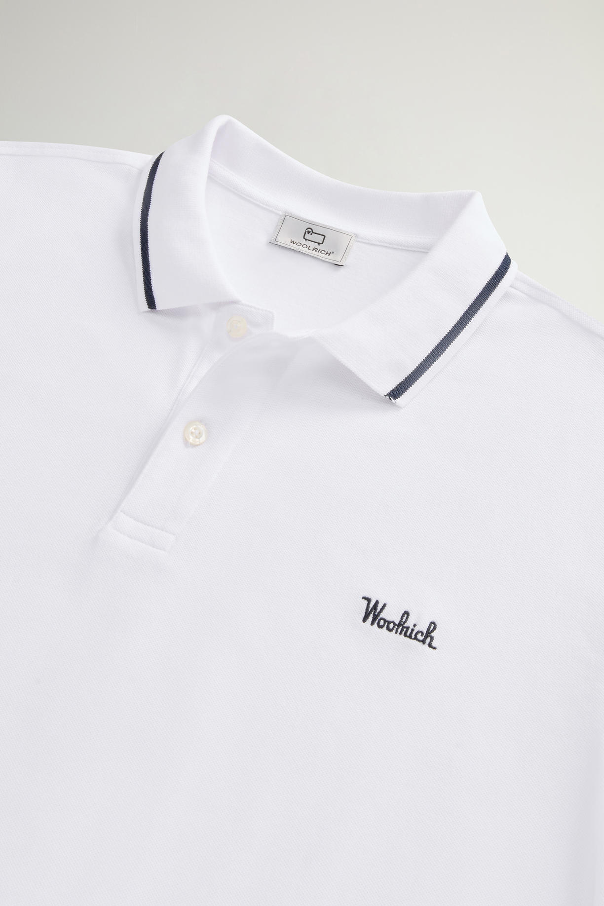 Polo Monterey in piquet di cotone elasticizzato con bordi a righe CFWOPO0066MRUT2556 8041 WOOLRICH Bright white 