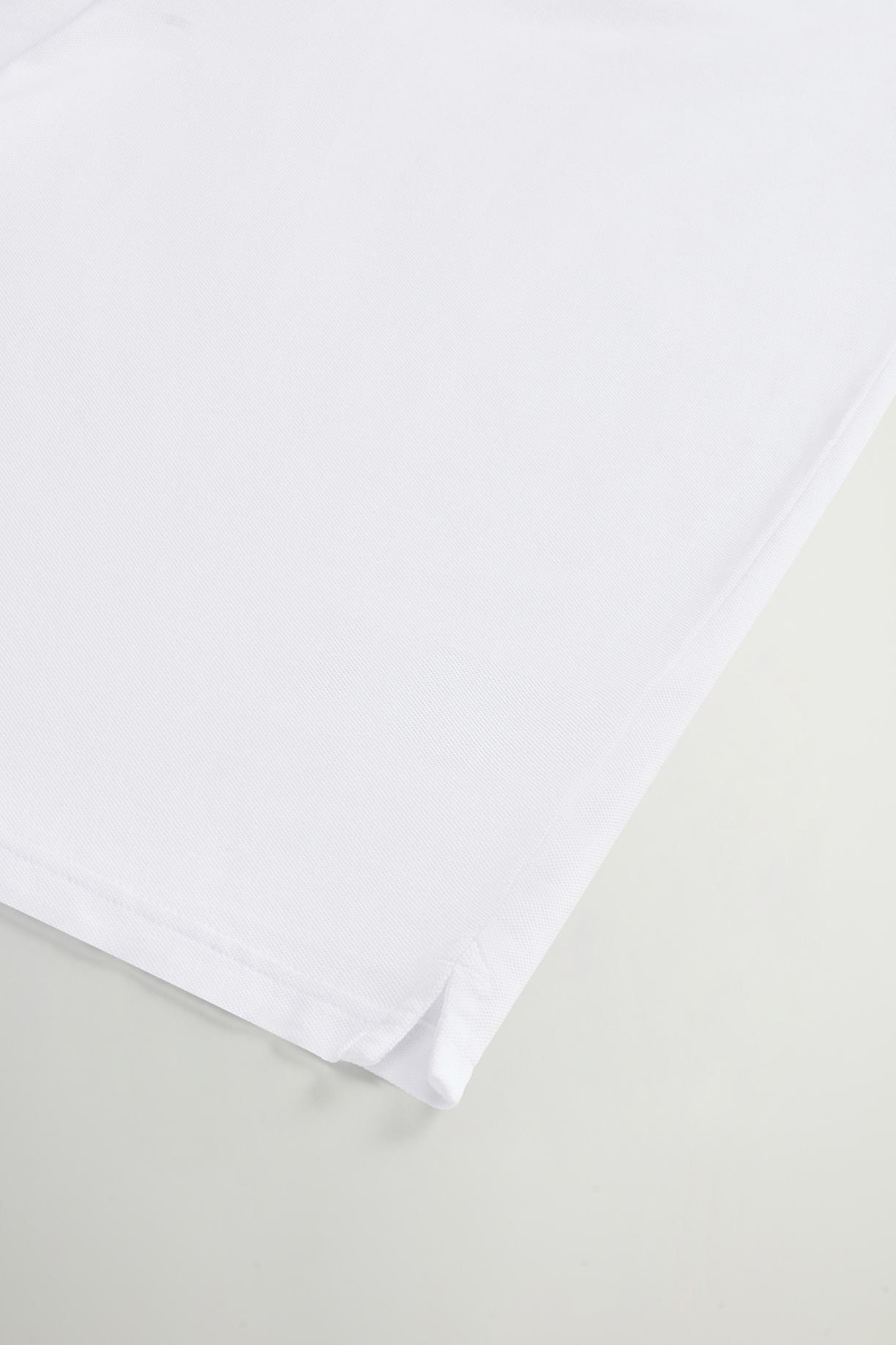 Polo Monterey in piquet di cotone elasticizzato con bordi a righe CFWOPO0066MRUT2556 8041 WOOLRICH Bright white 